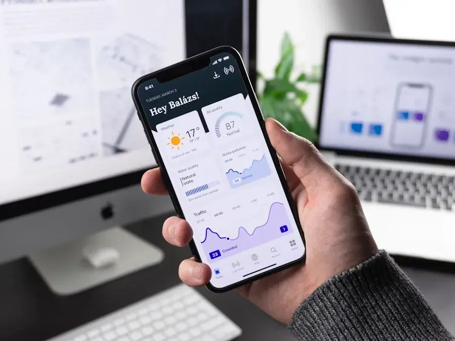Hand holding a phone with a finance app open